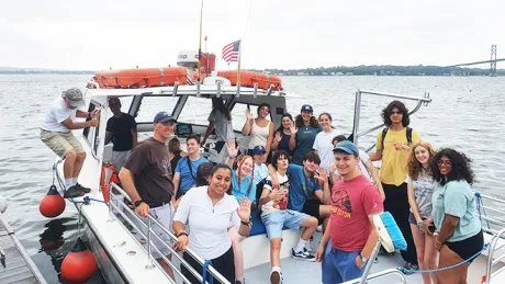 Marine Biology Summer Camp participants aboard RWU's research vessel, the InVinceable Spirit, off the coast of Mt. Hope Bay.