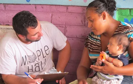 Student collects health info from a woman and baby