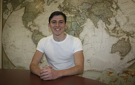 Anthony Salazar sits inside a classroom
