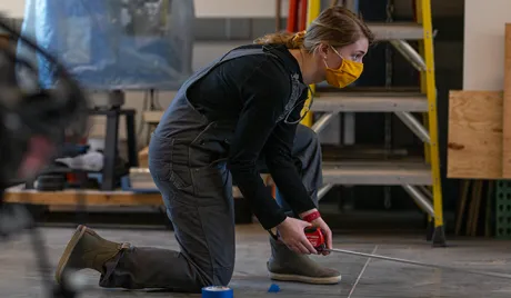 Audrey Corcoran using measuring tape