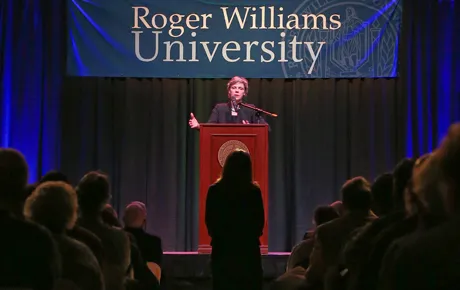 Woman speaks at lectern