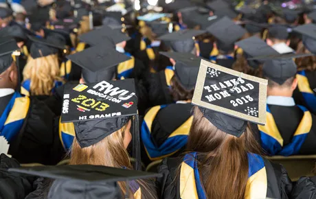 Graduates listen to a speaker