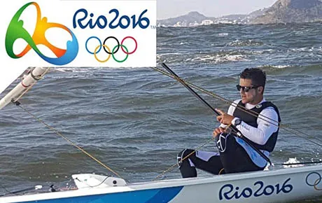 An Olympic athlete navigates his boat.