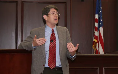 Man speaks to students