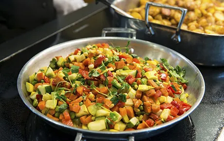 A healthful meal is prepared in the university dining commons.