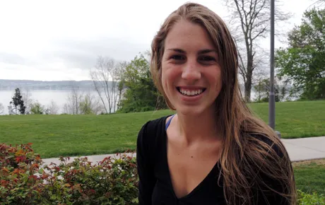 Student sits on university quad