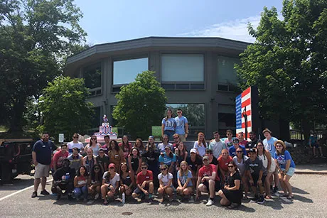 Students pose in front of the float.