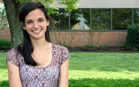 Student sits on university quad