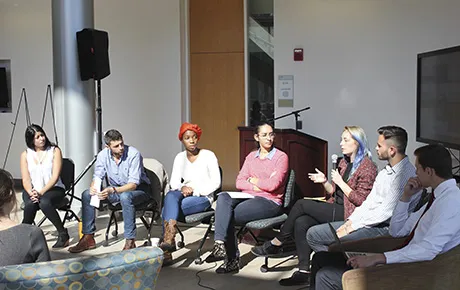 Students talk about social justice issues in a panel discussion.