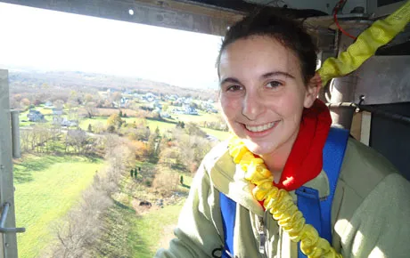 Student climbs to top of wind turbine