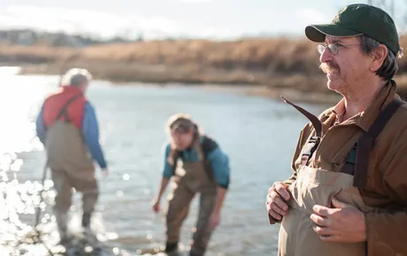 Professor and students work on shoreline