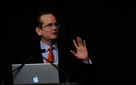 Man speaks at podium