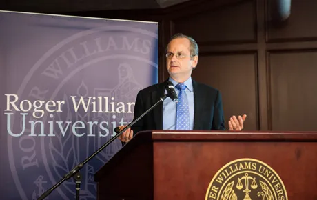 Man speaks to students