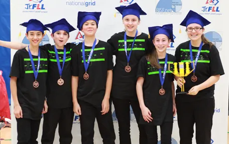 Young students celebrate winning the competition