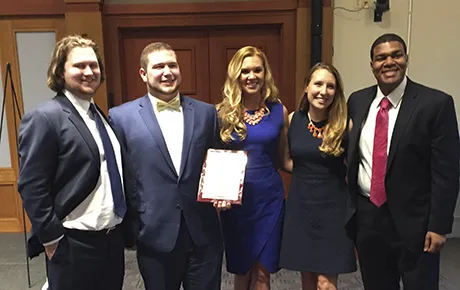 Students celebrate their win.