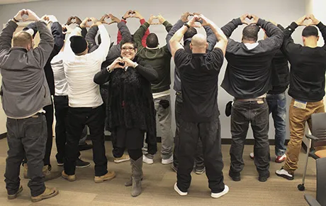 Inmates celebrate their graduation from a job-readiness program.