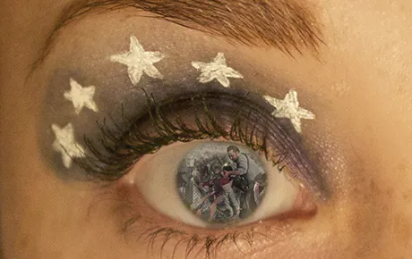 A collage of refugees inside the pupil of an eye.