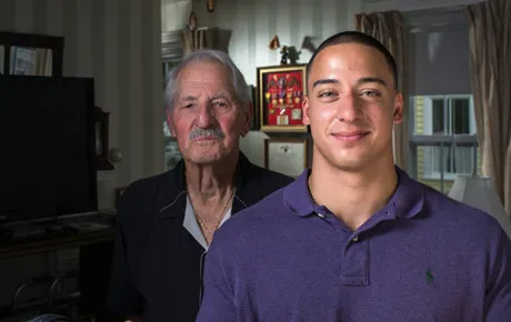 Student poses with a veteran he interviewed