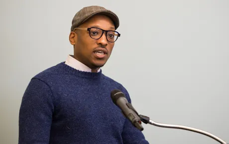 Man speaks at lectern