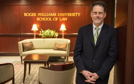 Dean stands inside his office