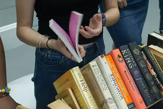 Student flips through book
