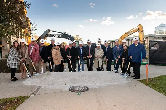 About one dozen people take part in the groundbreaking ceremony for the Richard L. Bready Applied Learning Laboratories