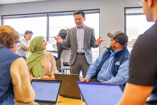 Students learn from MBA professor