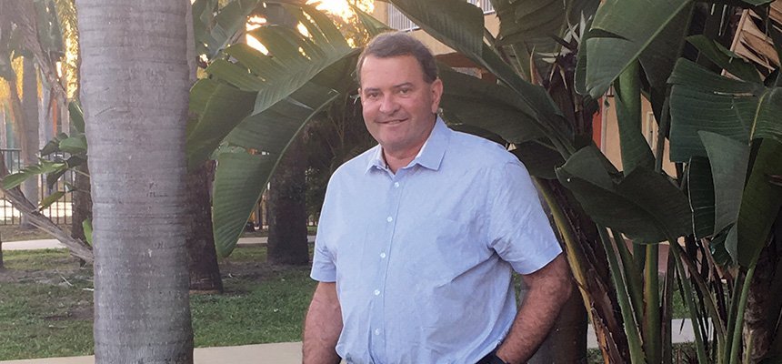 A photo of President Miaoulis in a tropical location