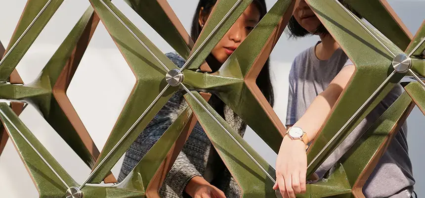 Students interacting with V Soleil sculpture