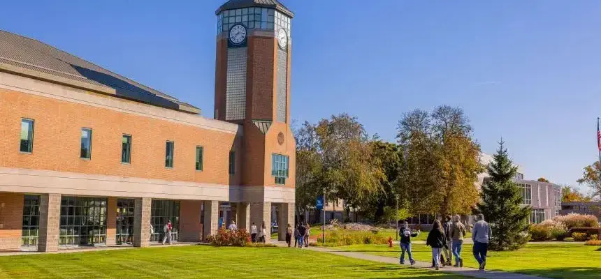 Students walk toward RWU library