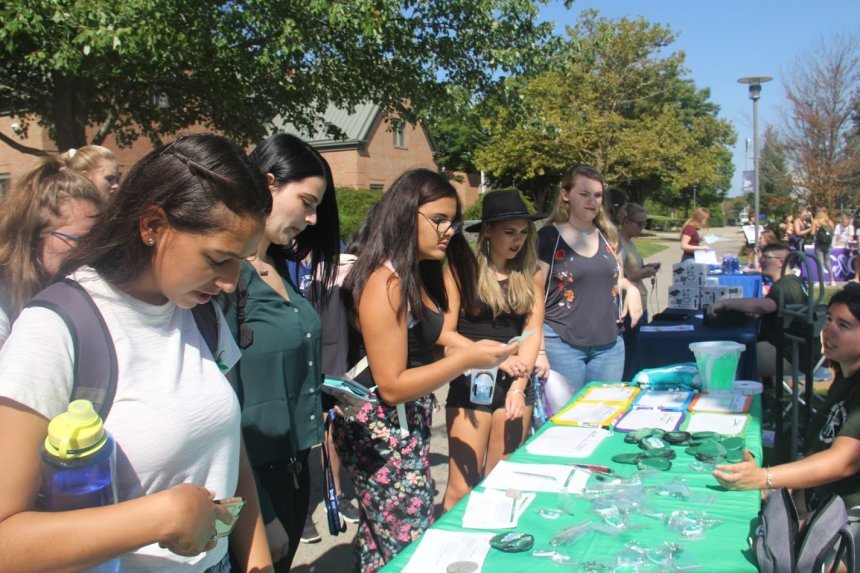 Students learning about Clubs and Organizations at the Involvement Fair