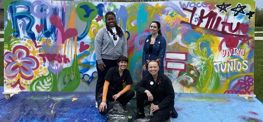 Students paint a mural on Bristol campus