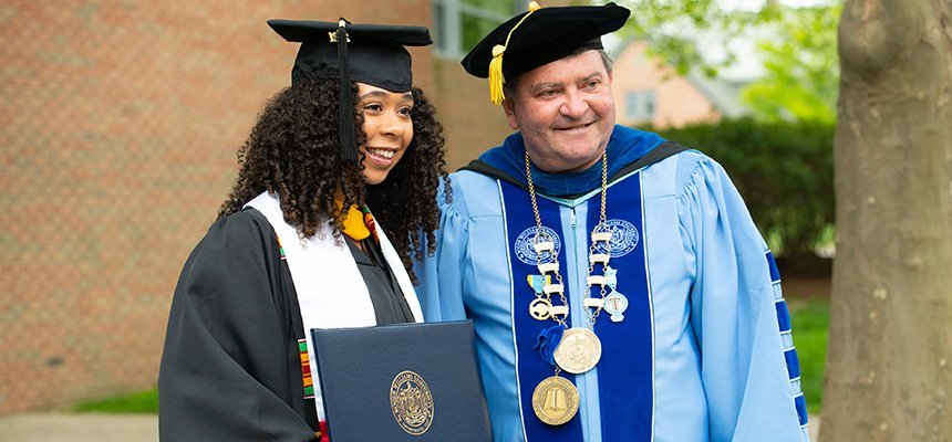 RWU President Miaoulis stands with graduating student