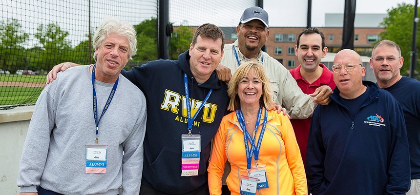 image of RWU alums coming together on campus in athletic gear
