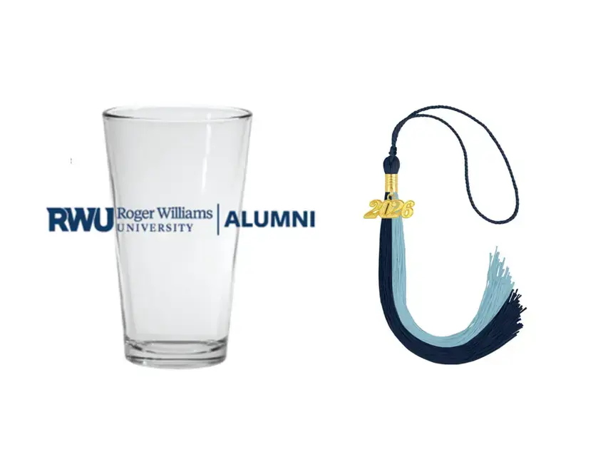 RWU Alumni pint glass next to navy and light blue tassel with 2026 charm for graduation cap