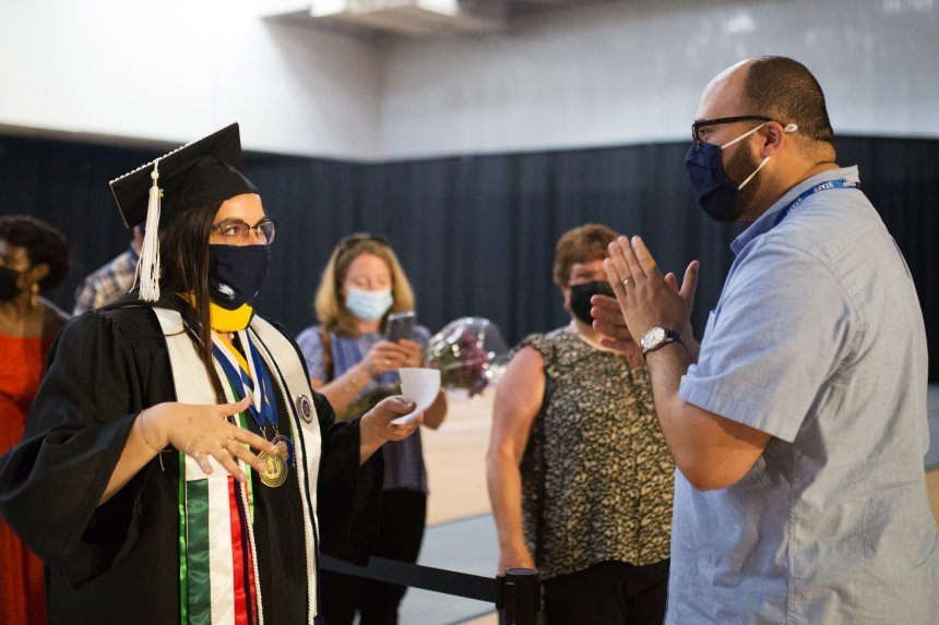 Image of a 2020 graduate celebrating