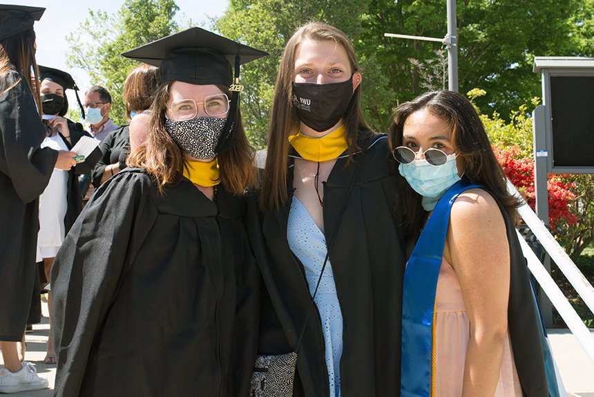 Image of three 2020 graduates posing 