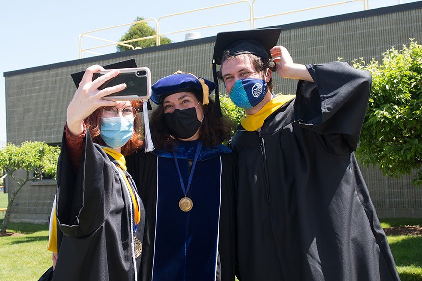 Image of 2020 graduates taking a selfie 