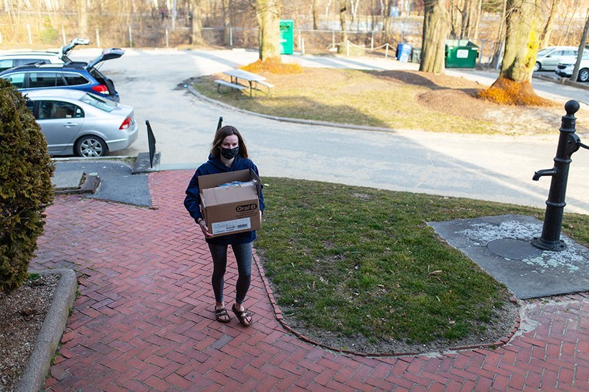 image of another member of RWU Field Hockey's Community Outreach group delivering donations to the Women’s Resource Center in Warren, RI, during Women’s History Month. 