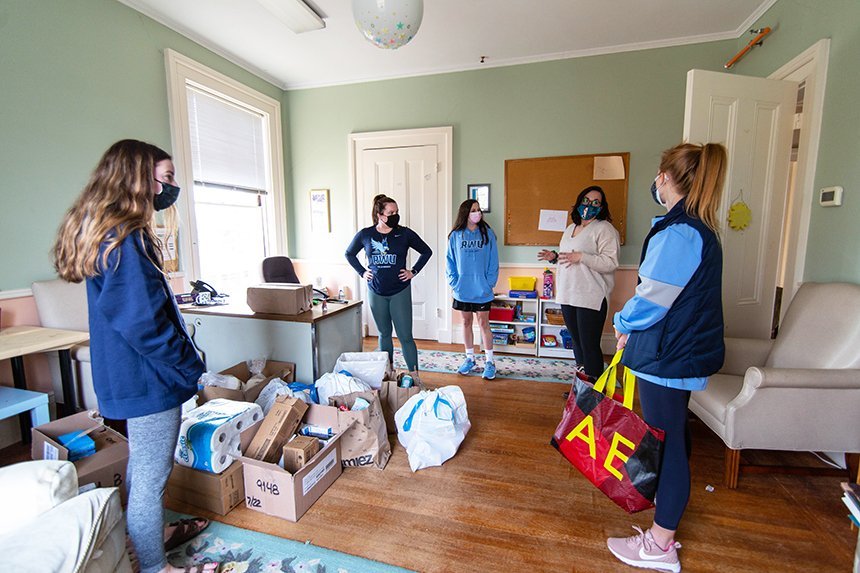image of RWU Field Hockey's Community Outreach group delivering donations to the Women’s Resource Center in Warren, RI, during Women’s History Month. 