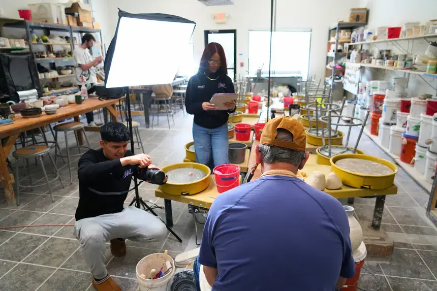 Wilder, Juliet Garcia-Baez, and Denis Leonti film a video on Saturday morning.