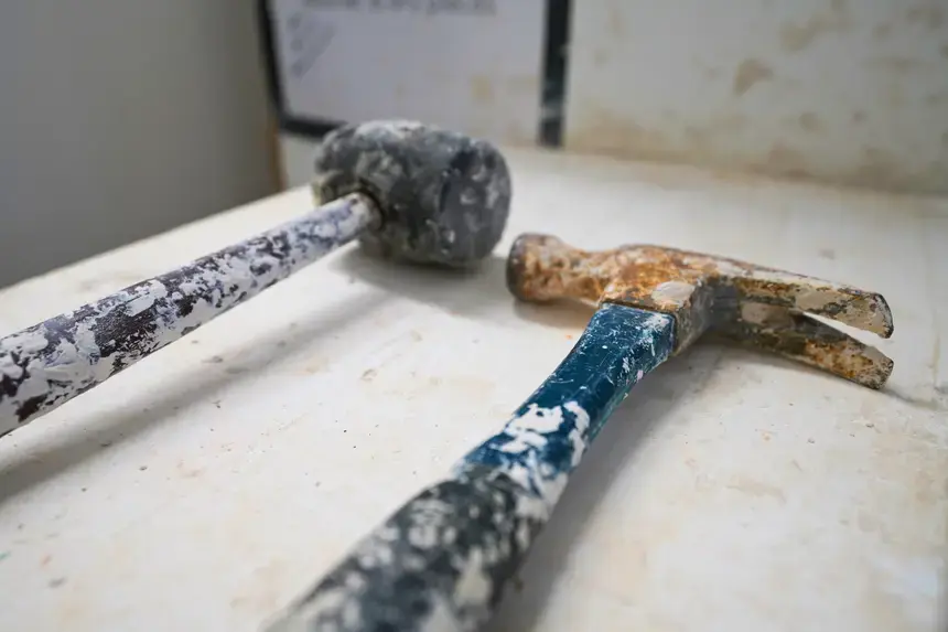 Denis Leonti's tools remain on his table, covered in remnants of clay.
