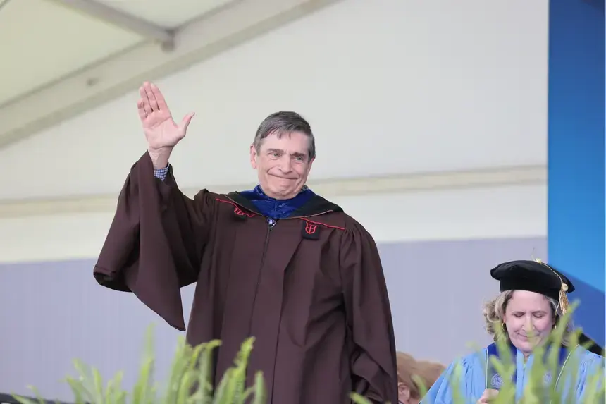 Philosophy Professor Bob Blackburn receives a round of applause. He has spent 58 years with RWU