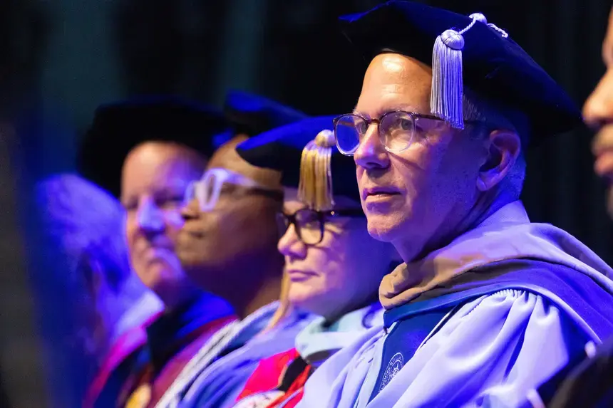 Interim President Brian Williams sits alongside Cabinet members and faculty during the Convocation ceremony.