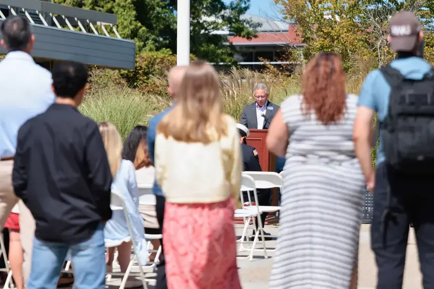 Students listen to Interim President Brian Williams speak during the Sept. 11 remembrance event.