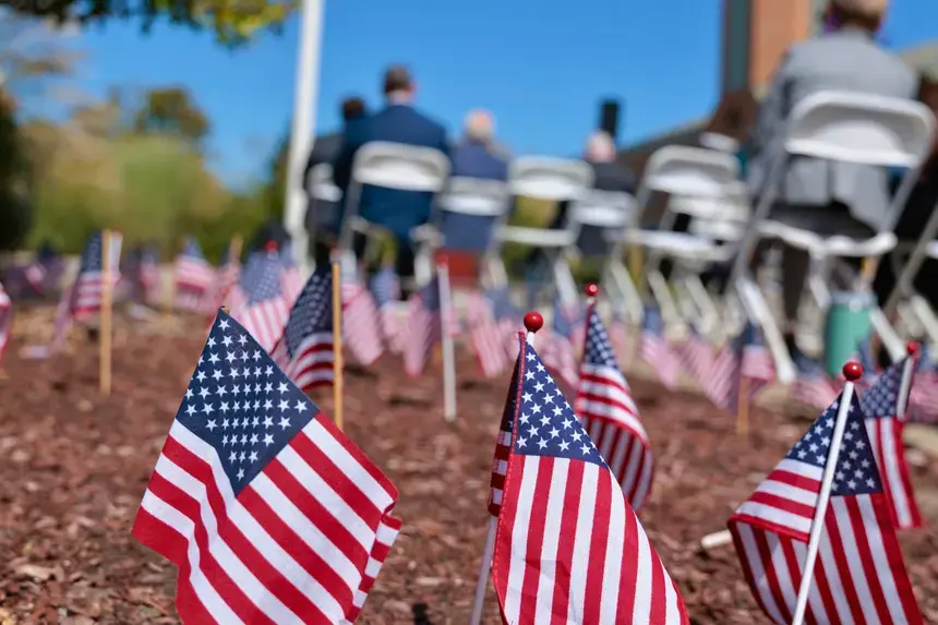 Flags are placed in the grounds outside the Administration Building.