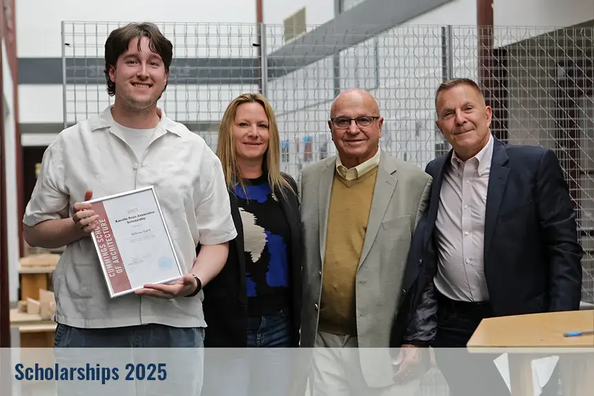 Student posing with their scholarship award