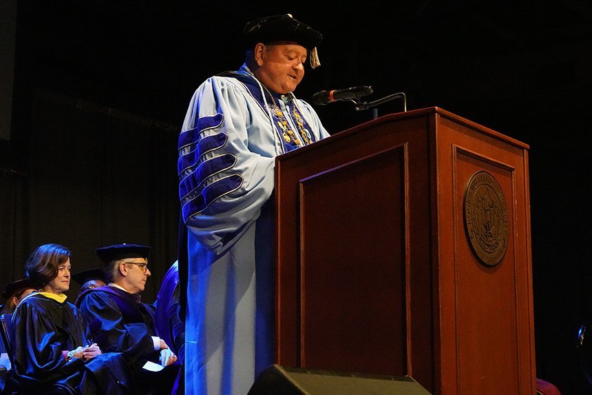 President Ioannis Miaoulis stands at a podium and delivers his Convocation speech