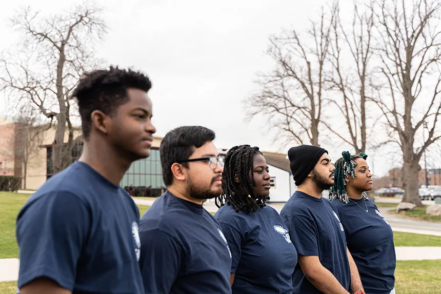 Five of the six MSU e-board members stand outside in a row. 