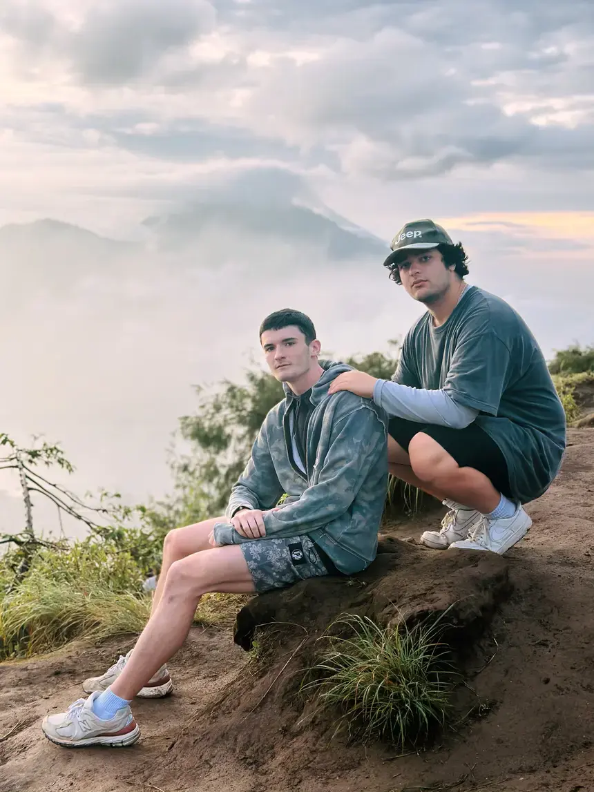 Two male students pose for a photo in Indonesia
